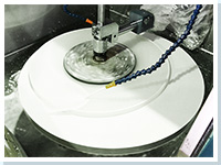 Lens polishing machine